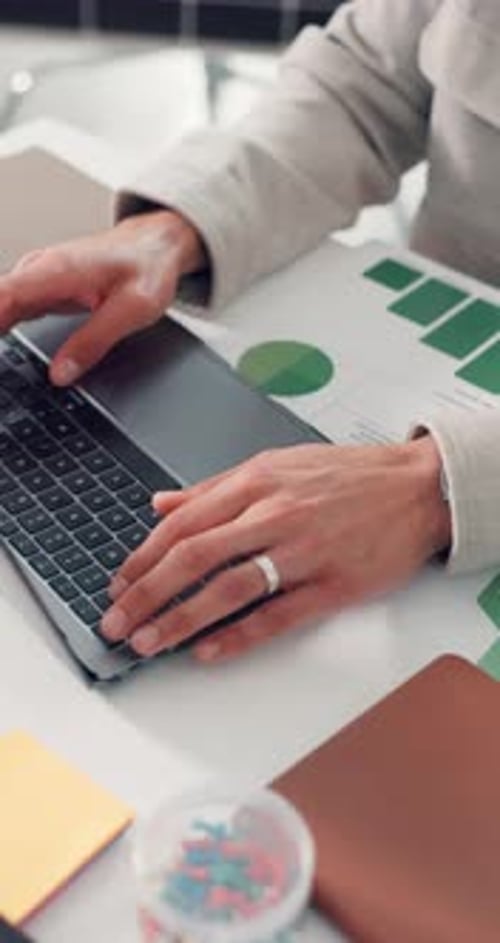 Hands, person and typing on laptop in office with charts, energy saving stats and sustainability