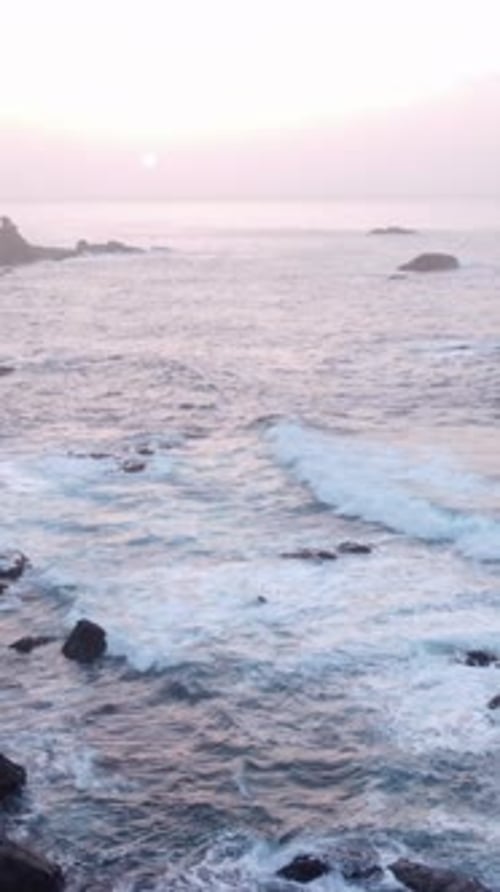 Peaceful Ocean Scene Gentle Waves and Vibrant Sunset Colors Create Soothing Aquatic Landscape for