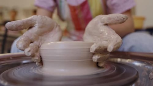 Creating a Clay Bowl on the Pottery Wheel in a Studio Setting