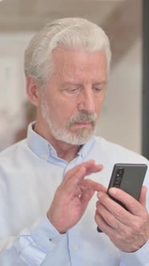 Blogging Senior Old Businessman Doing Video Chat in Office, vertical video