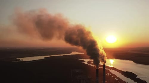 High voltage post. High-voltage tower sky background, factory pipe with smoke over it.