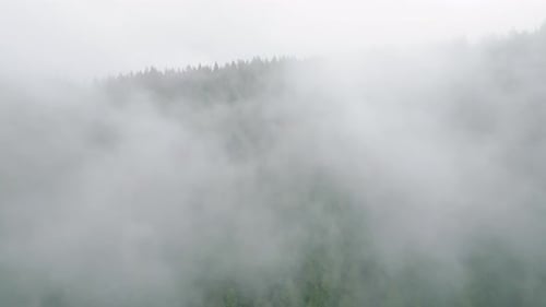 Aerial View of Beautiful Mountain Landscape Fog Rises Over the Mountain Slopes