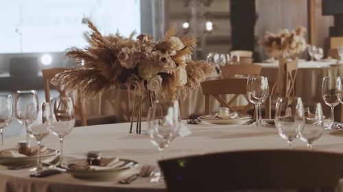 Wedding Banquet Table Setting with Floral Centerpiece