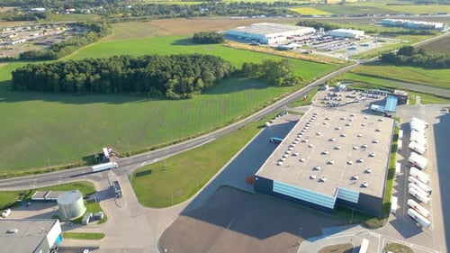 Aerial view of goods warehouse. Logistics center delivery in industrial city zone from above. Aerial