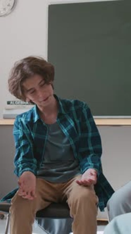 Boy Receiving Support After Sharing his Problems at Group School Counseling