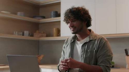 Young Adult Video Calling in Kitchen