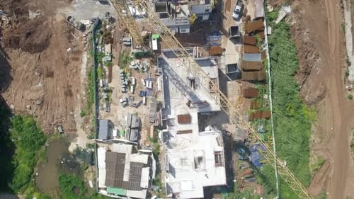 Large residential construction site with cranes, Aerial view