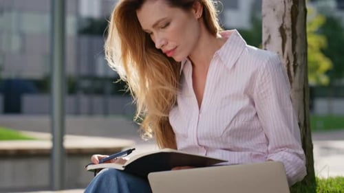 Beautiful Woman Writing Notes in Park Closeup Focused Freelancer Work Outside
