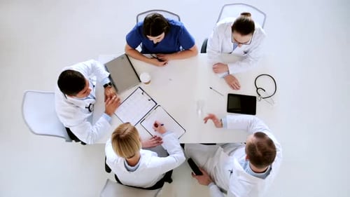 Doctors discussing cardiology and healthcare at a hospital conference