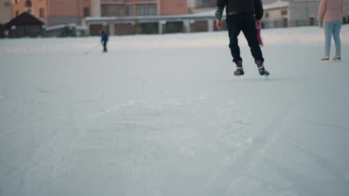 People Ice Skating on a Sunny Winter Day