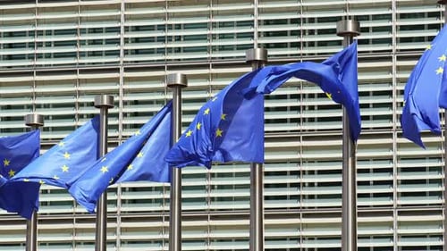 European Union Flags Waving Outside Modern Building