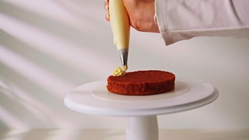 Decorating Small Cake with Cream Icing