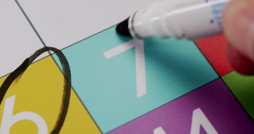 CloseUp of Calendar with Date Marked and Highlighted in Black Circle