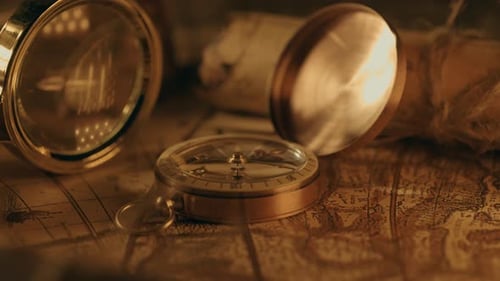 Old World Map with Compass and Magnifying Glass