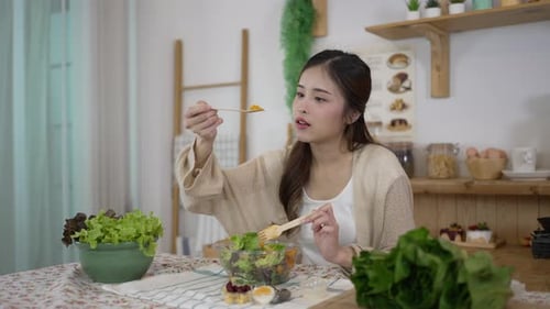 Young Woman Enjoys Healthy Salad at Home