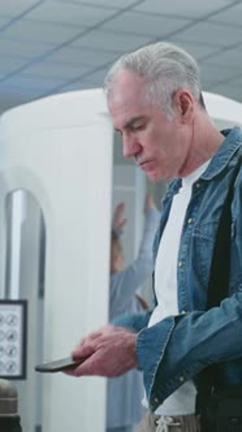 Security Check in Airport Diverse People Putting Personal Items Bags for Xray Scanning