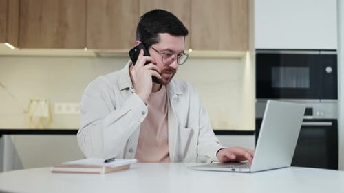 Young Adult Working From Home On Laptop