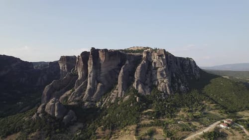 Aerial of imposing rock columns with cliff top monasteries, Meteora, Thessaly