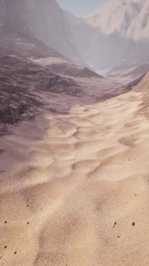 Aerial View of a Desert Landscape with Majestic Mountains in the Distance