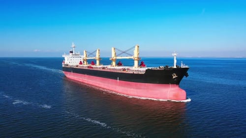 Cargo Ship Sailing on Calm Blue Ocean Waters