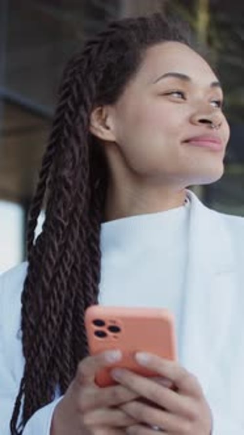 Portrait of Attractive Young Woman Stand Use Mobile Phone Smiling on Street Relaxing Outdoors Slow