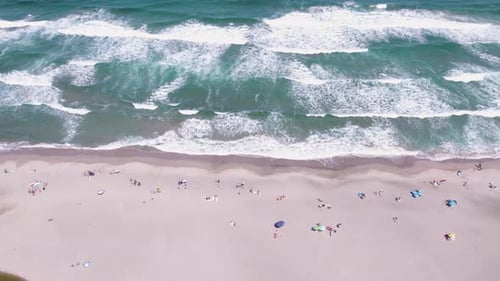 Aerial View of Beach with Turquoise Waters and People