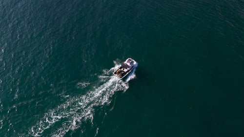 Boat Motoring Across the Ocean on a Sunny Day