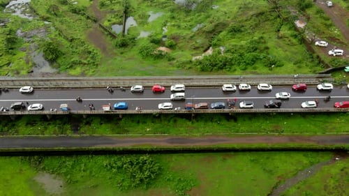 lonavla city hill station dron shot following car top view birds eye view in rainy day city inova p