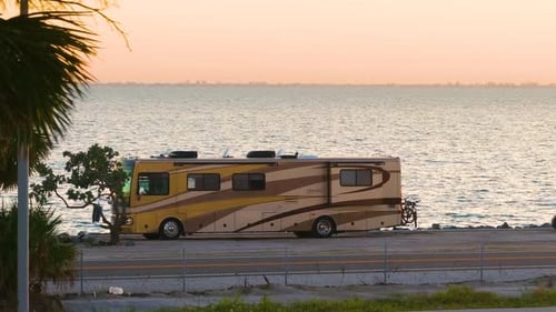 RV Campground Near Sunshine Skyway Bridge at Sunset with Parked Campers and Evening Sky