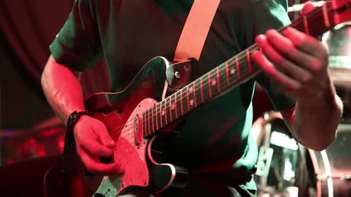 Guitarist Plays Electric Guitar at Nightclub Concert