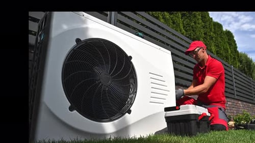 Professional HVAC Worker Installing Swimming Pool Heat Pump