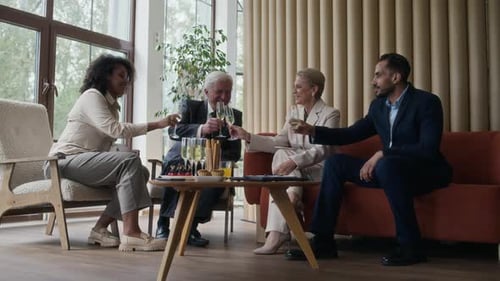 Business Team Toasting Champagne at Corporate Celebration