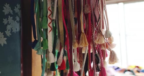 Kimono, decoration and Japanese obi belt in fabric shop with embroidery pattern