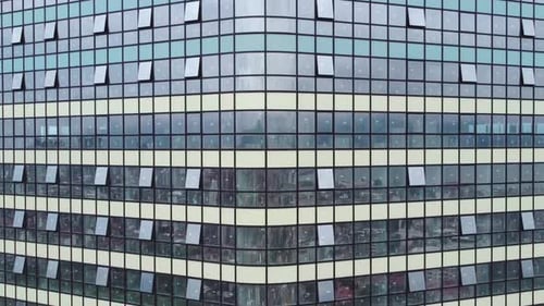 Modern High-Rise Building. Glass Skyscraper Aerial. Reflective Glass Skyscraper.