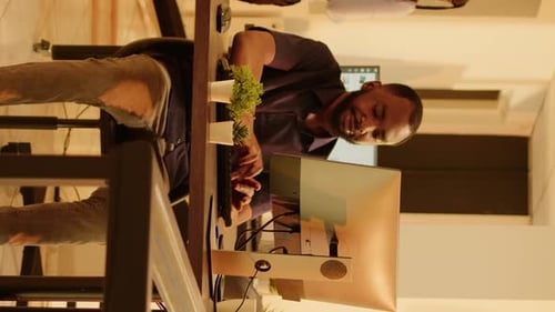 Vertical Video Male Employee Browsing Internet on Computer in Business Office