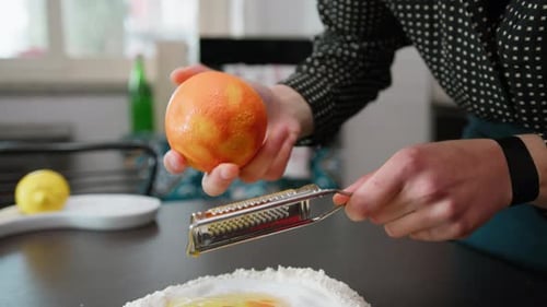 Grate Fresh Orange Fruit Zest For The Dough Of A Homemade Easter Cake