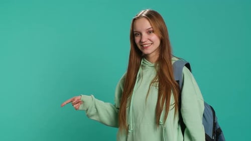 Smiling Woman Pointing in Various Directions with Backpack