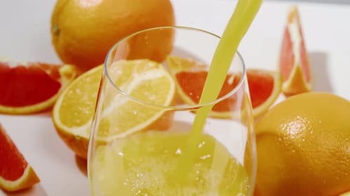 Refreshing Orange Juice Being Poured Into Glass