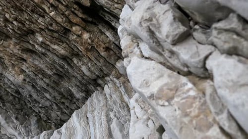 Natural, abstract rock formations with cracks, layers and textures