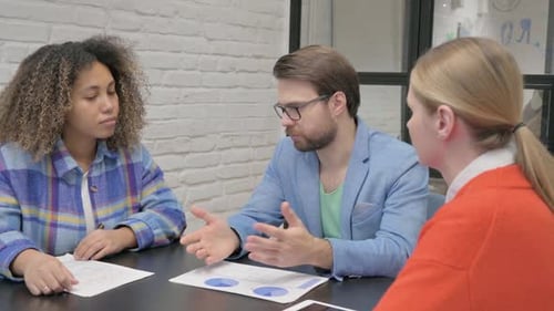 Close up of Businessman Talking with Colleagues
