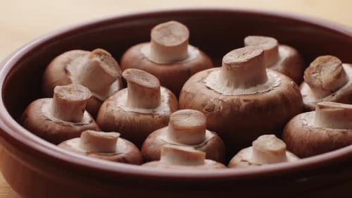Freshly Picked Mushrooms on Home Kitchen Close Up Texture of Brown Champignon Woman Cooking Tasty