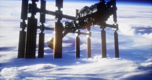 International Space Station Orbits Earth at Sunset with Glowing Clouds