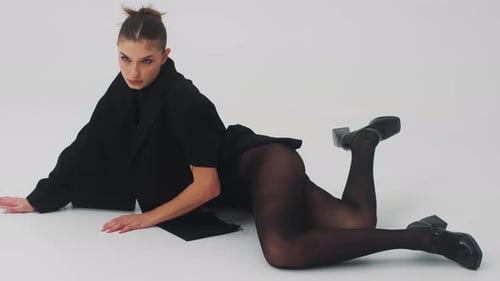 Young Woman Modeling Fashion in Studio