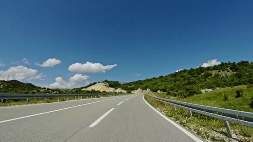 Driving a Car Along a Winding Mountain Road