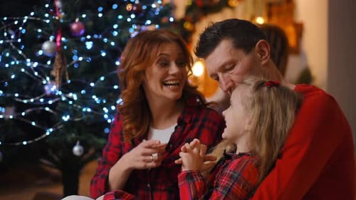 Loving Family Talking near Christmas Tree