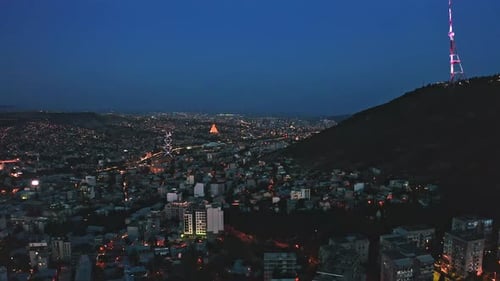 Scenic night view of Tbilisi city and Mtatsminda mountain
