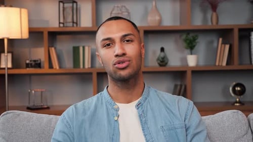 Young Man Talking and Smiling on Video Call