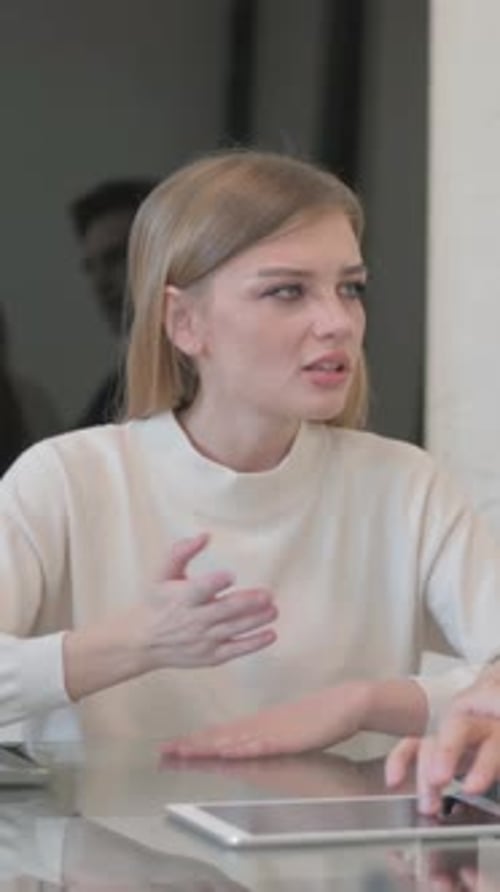 Mixed Race Entrepreneurs Discussing Business in Office, vertical video