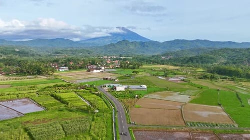 Drone view of motorbikes crossing on the beautiful countryside highway road