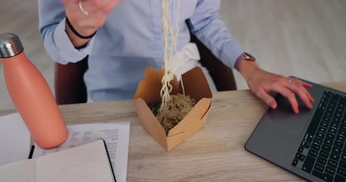 Eating, office and hands for night, laptop and person with noodles for overtime
